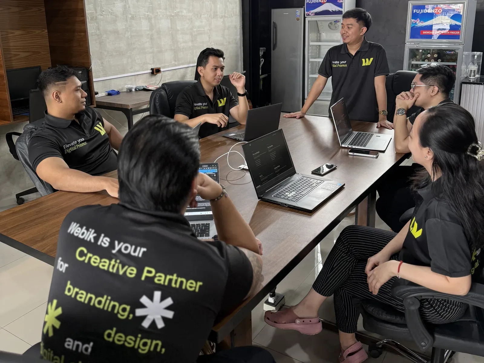 The team at work around the studio table